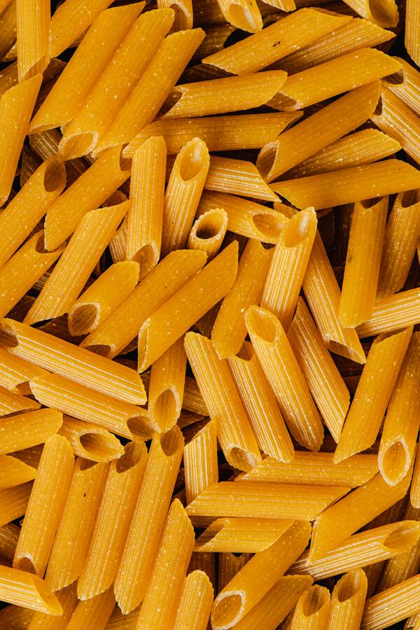 A variety of healthy complex carbohydrates like oats, sweet potatoes, brown rice, and whole-grain bread.