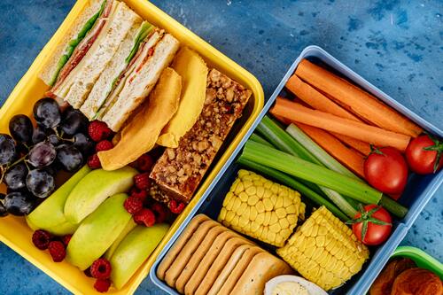 A collection of pre-workout food options: a banana, oatmeal, a protein shake, and toast with avocado.